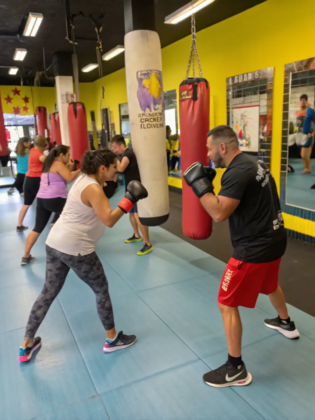 A vibrant photo of BOXE COOP members sparring in a friendly match, emphasizing the camaraderie and supportive atmosphere.
